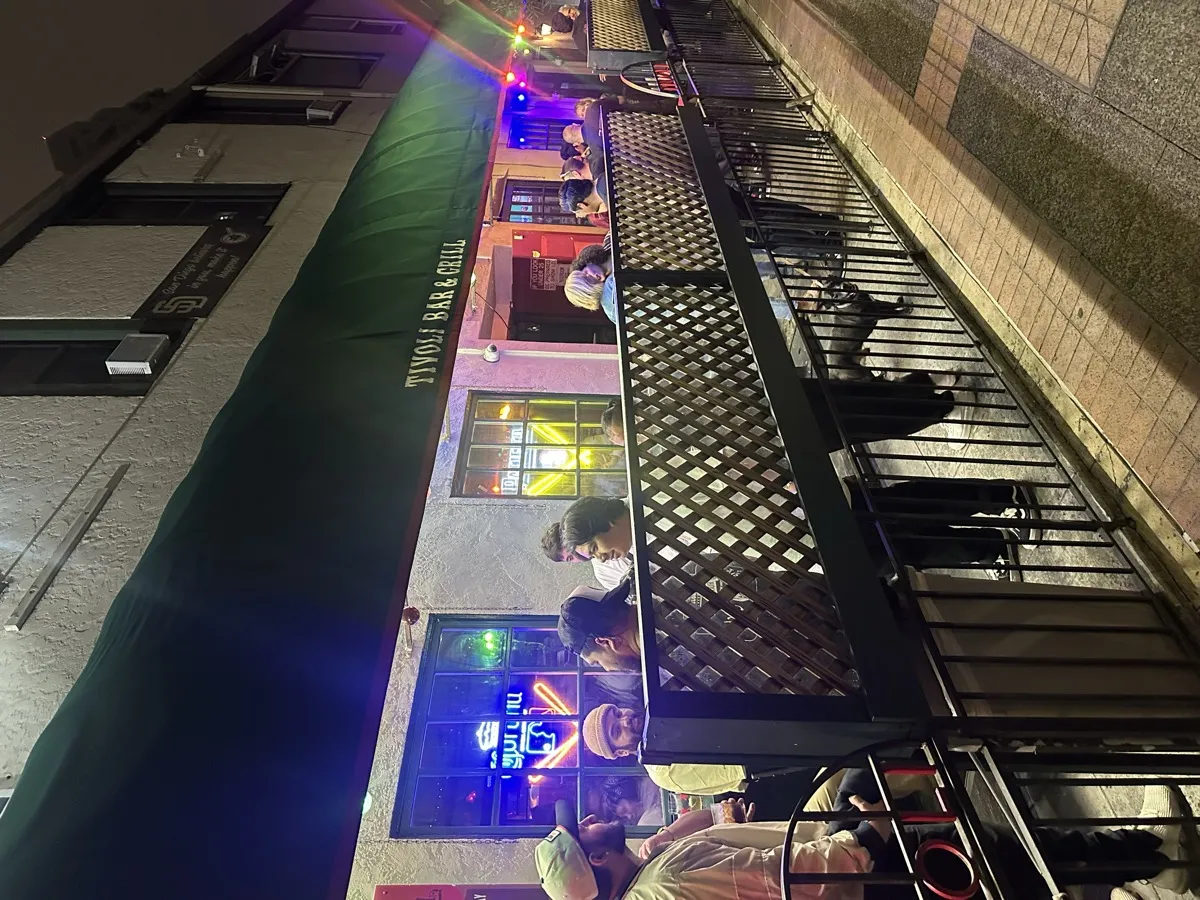 Tivoli Bar and Grill exterior showing the Padres SD logo on the building